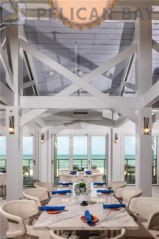 a view of a dining room with furniture wooden floor and chandelier
