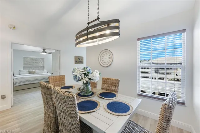 a dining room with furniture and a window