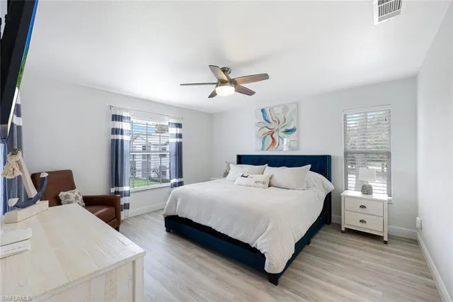 a bedroom with a bed and window