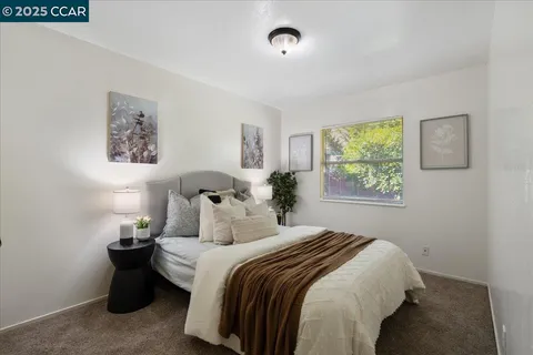 a bedroom with bed and window