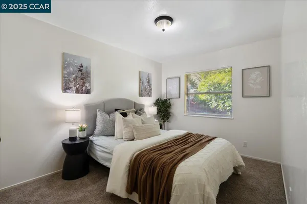 a bedroom with bed and window