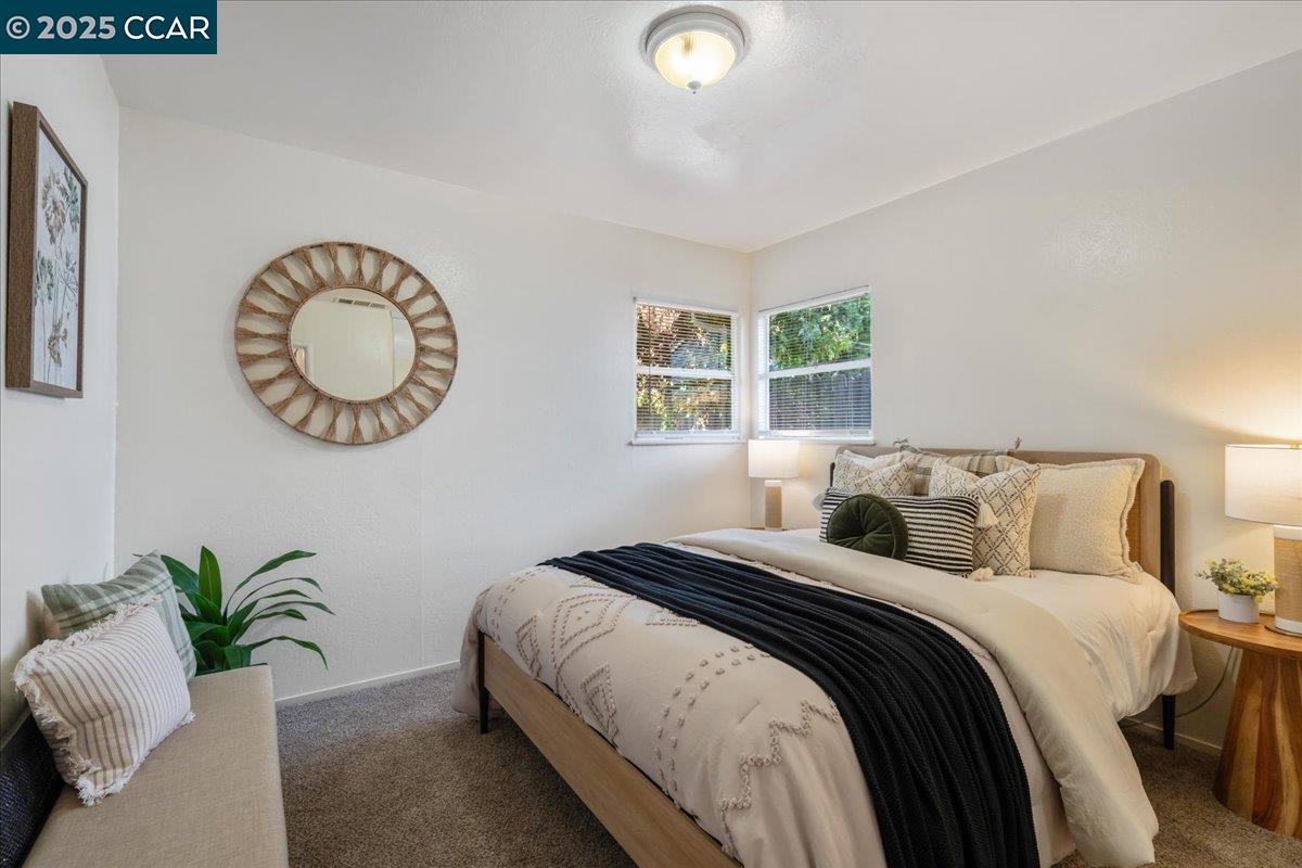 725 Del Norte Street Vallejo, CA 94591 - Photo 21 of 25 a bedroom with a bed and a potted plant