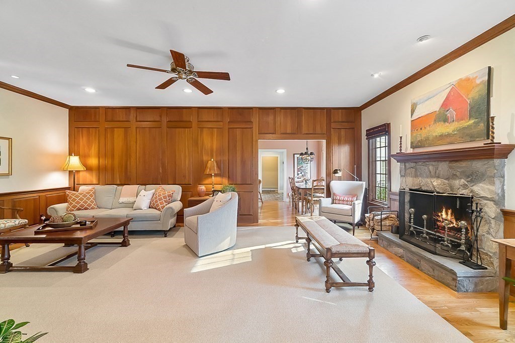 853 Strawberry Hill Road Concord, MA 01742 - Photo 16 of 41 a living room with furniture and a fireplace