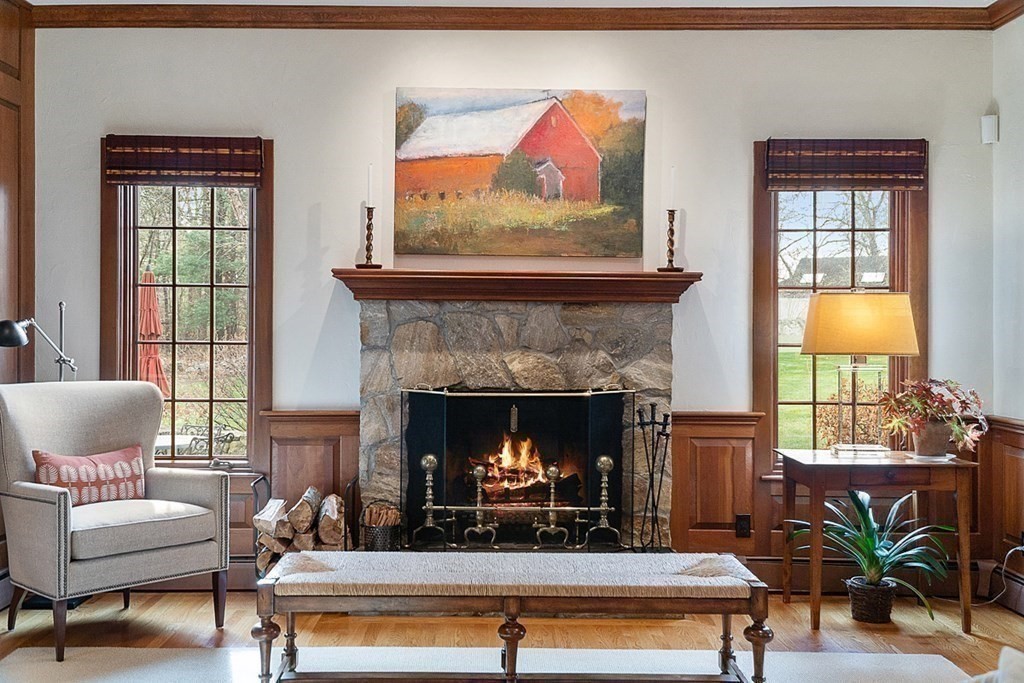 853 Strawberry Hill Road Concord, MA 01742 - Photo 17 of 41 a living room with furniture and a fireplace