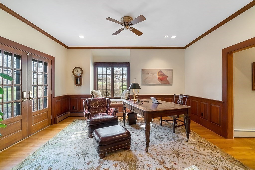 853 Strawberry Hill Road Concord, MA 01742 - Photo 18 of 41 a living room with furniture a rug and a large window