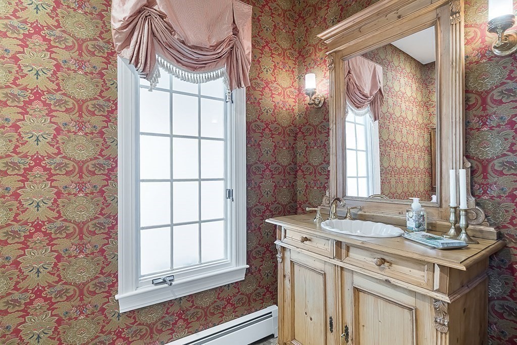 853 Strawberry Hill Road Concord, MA 01742 - Photo 20 of 41 a bathroom with a sink a vanity and a mirror