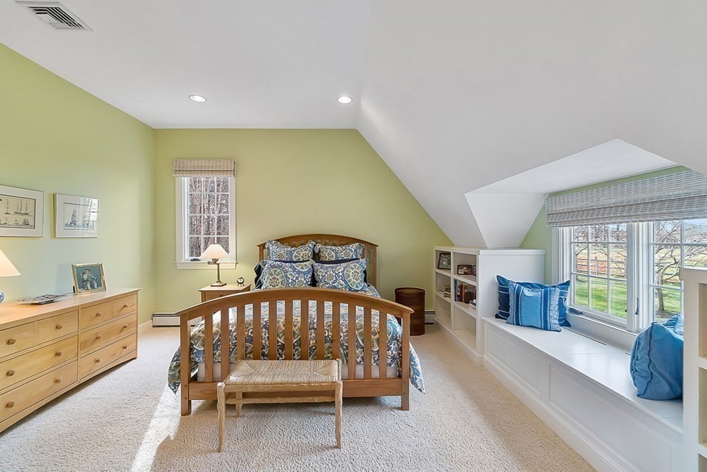 853 Strawberry Hill Road Concord, MA 01742 - Photo 27 of 41 a bedroom with a bed and large windows