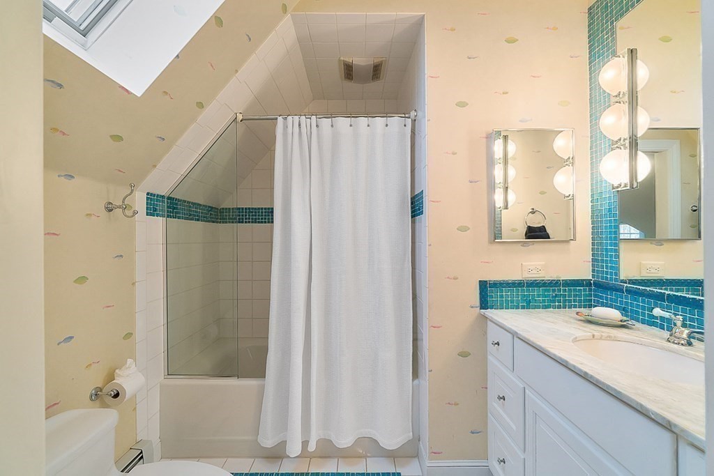 853 Strawberry Hill Road Concord, MA 01742 - Photo 28 of 41 a bathroom with a granite countertop sink and a mirror
