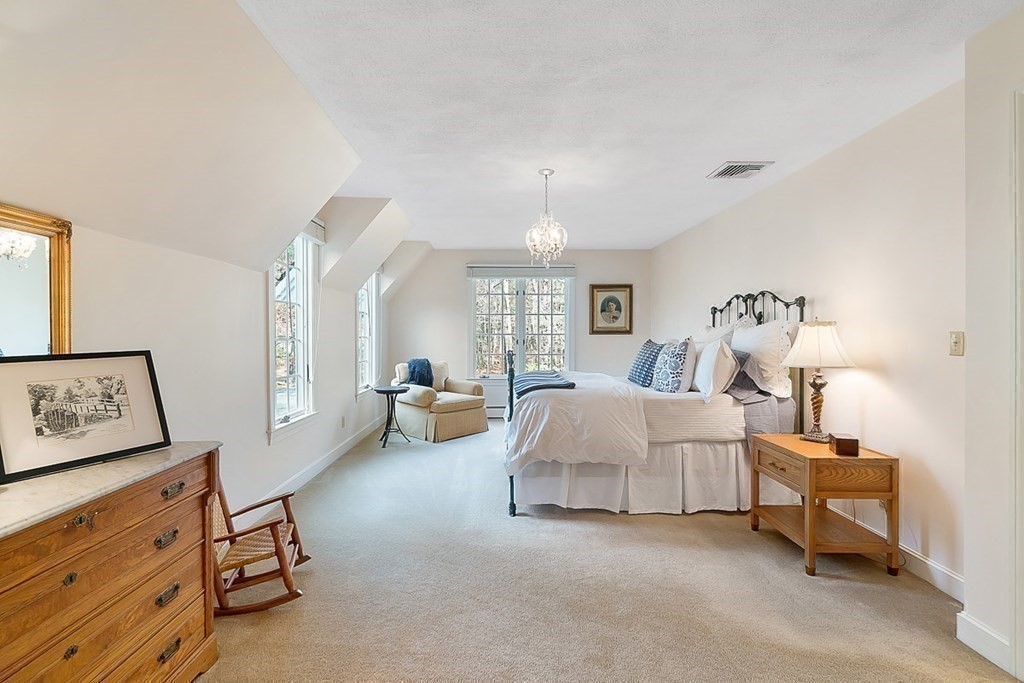 853 Strawberry Hill Road Concord, MA 01742 - Photo 30 of 41 a bed room with furniture and a lamp
