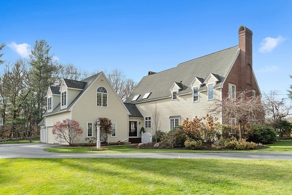 853 Strawberry Hill Road Concord, MA 01742 - Photo 3 of 41 a view of a house with a yard