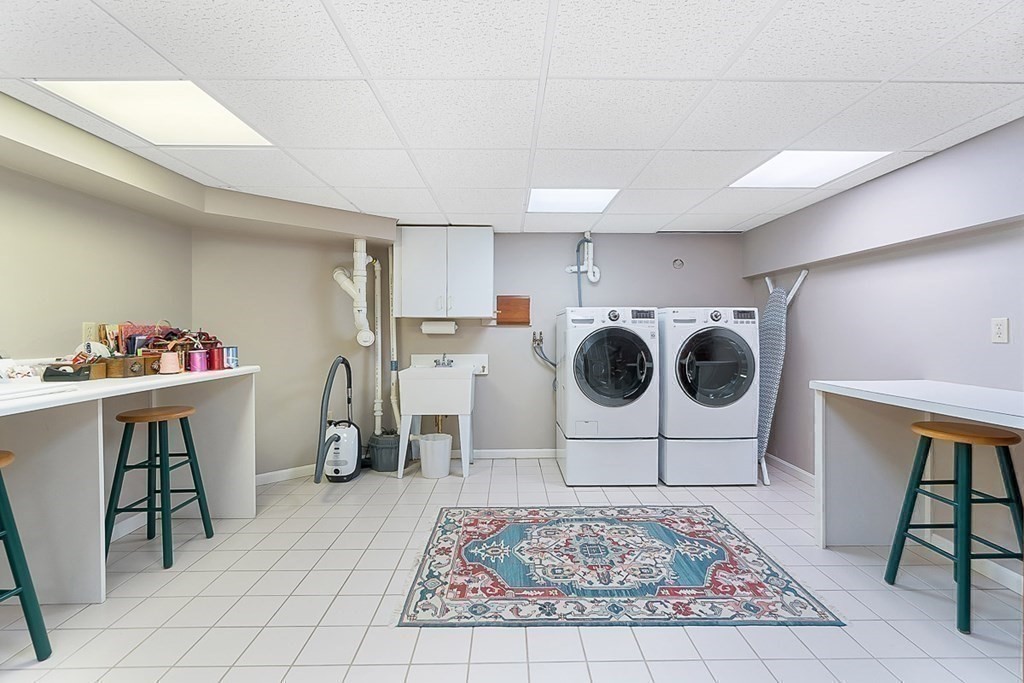 853 Strawberry Hill Road Concord, MA 01742 - Photo 36 of 41 a view of a hallway with washer and dryer