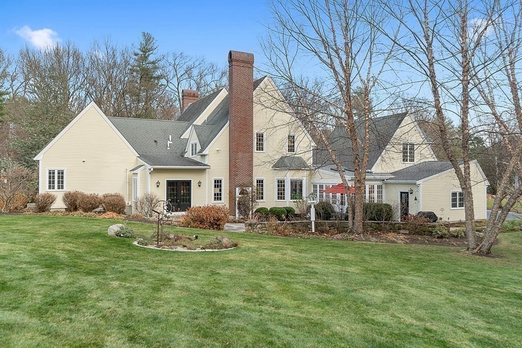 853 Strawberry Hill Road Concord, MA 01742 - Photo 40 of 41 a front view of house with yard and green space