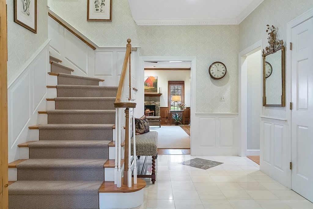 853 Strawberry Hill Road Concord, MA 01742 - Photo 6 of 41 a view of entryway and hall with wooden floor