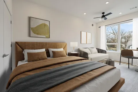 a bedroom with a bed and a couch