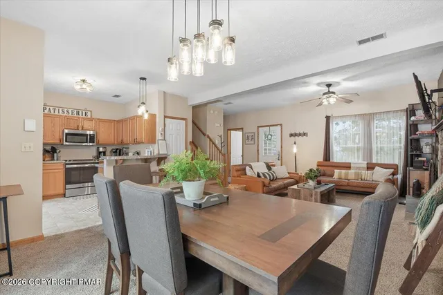 a view of front door with hallway and stairs