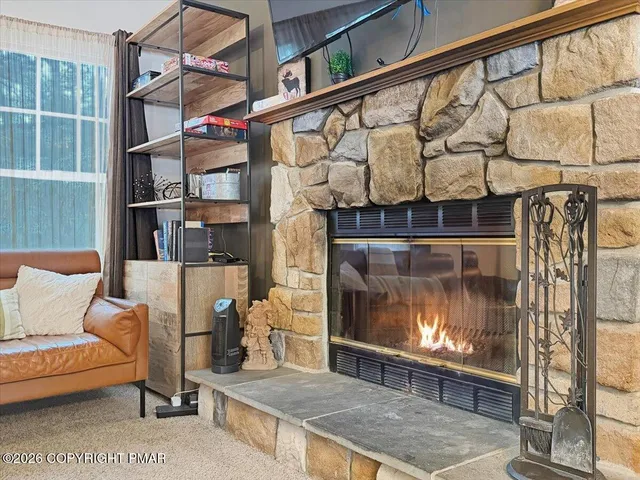 a living room with a couch and a fireplace