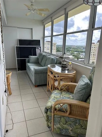 a kitchen with kitchen island granite countertop a sink cabinets and stainless steel appliances
