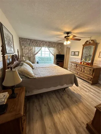 a room with a sink and a wooden floor