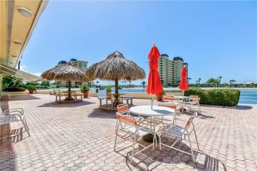 4775 Cove Circle, Unit 1202 Madeira Beach, FL 33708 - Photo 29 of 32 a view of outdoor space with seating area