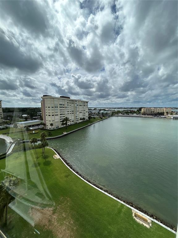 4775 Cove Circle, Unit 1202 Madeira Beach, FL 33708 - Photo 3 of 32 a view of a lake with a city