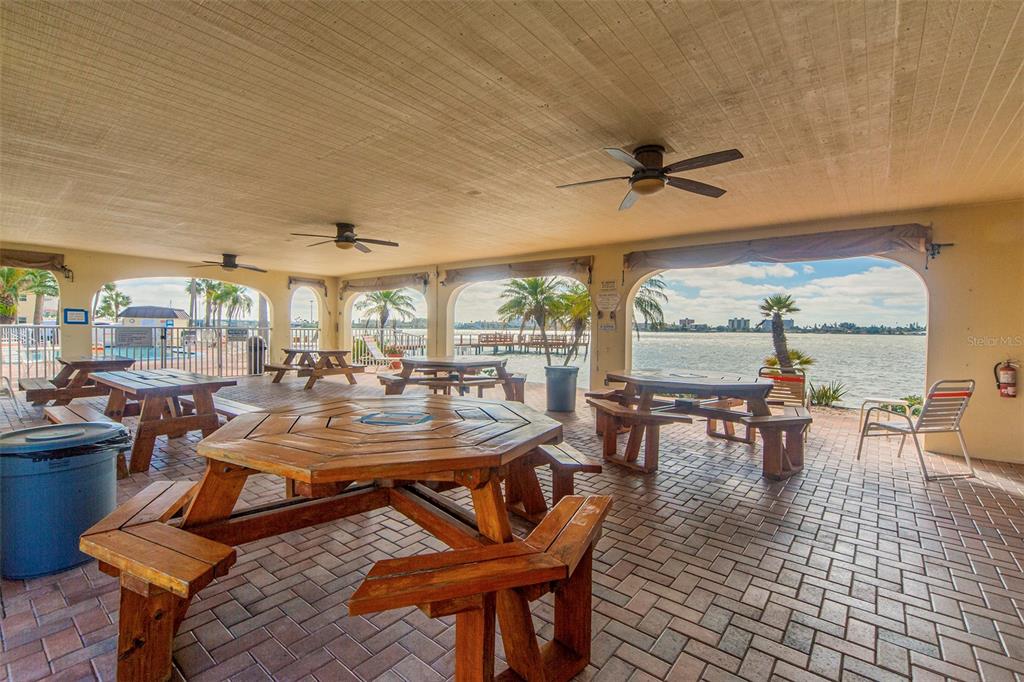 4775 Cove Circle, Unit 1202 Madeira Beach, FL 33708 - Photo 31 of 32 a view of a dining room with furniture
