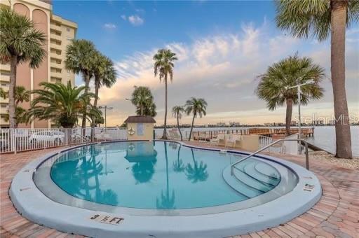 4775 Cove Circle, Unit 1202 Madeira Beach, FL 33708 - Photo 32 of 32 a view of outdoor space with swimming pool