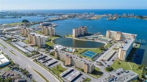 4775 Cove Circle, Unit 1202 Madeira Beach, FL 33708 - Photo 5 of 32 an aerial view of a house with outdoor space