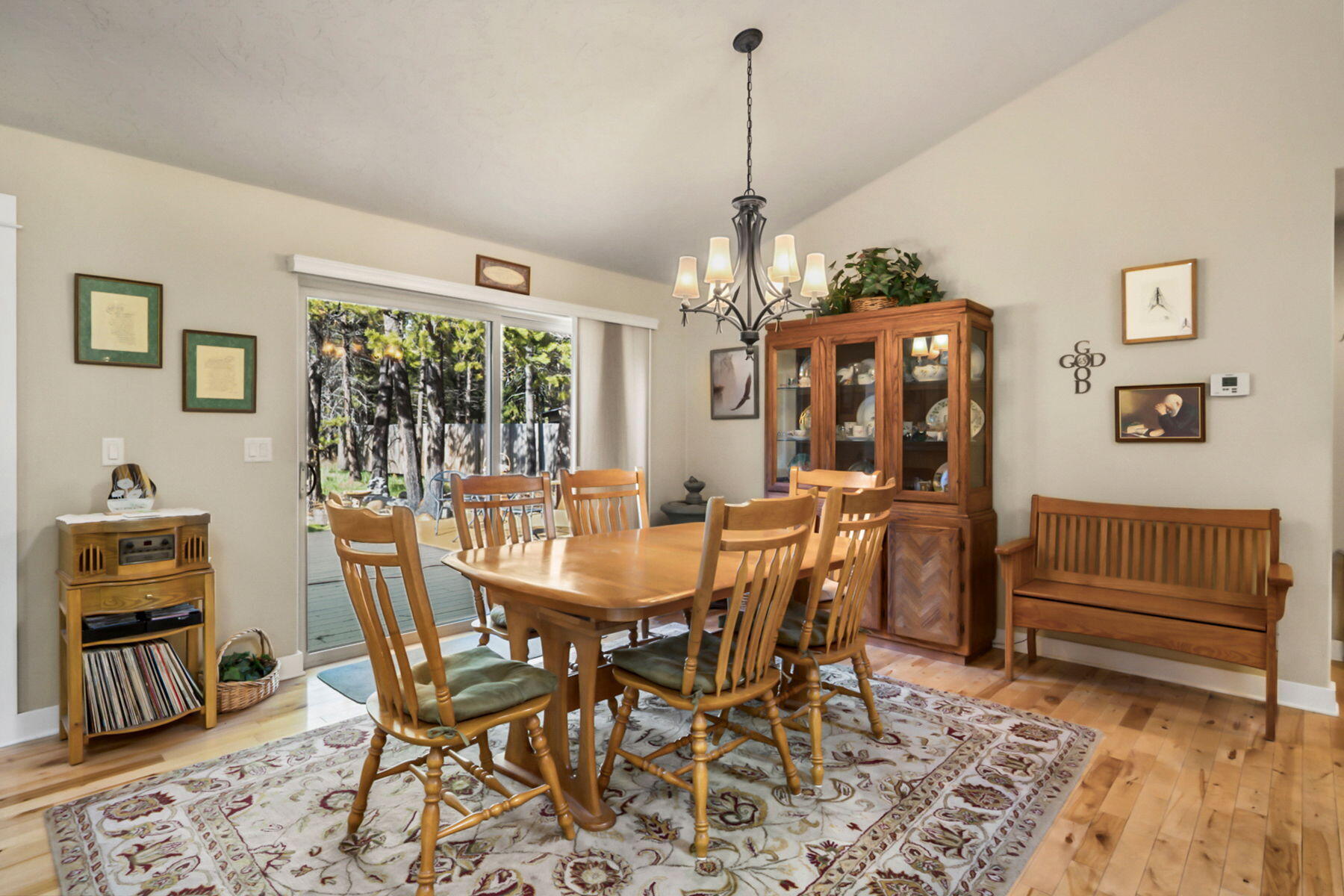 17048 Norwalk Road Bend, OR 97707 - Photo 12 of 36 a view of a dining room with furniture window and wooden floor