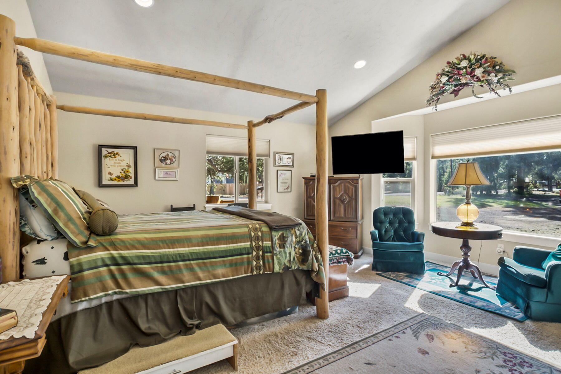 17048 Norwalk Road Bend, OR 97707 - Photo 13 of 36 a spacious bedroom with a bed and glass windows