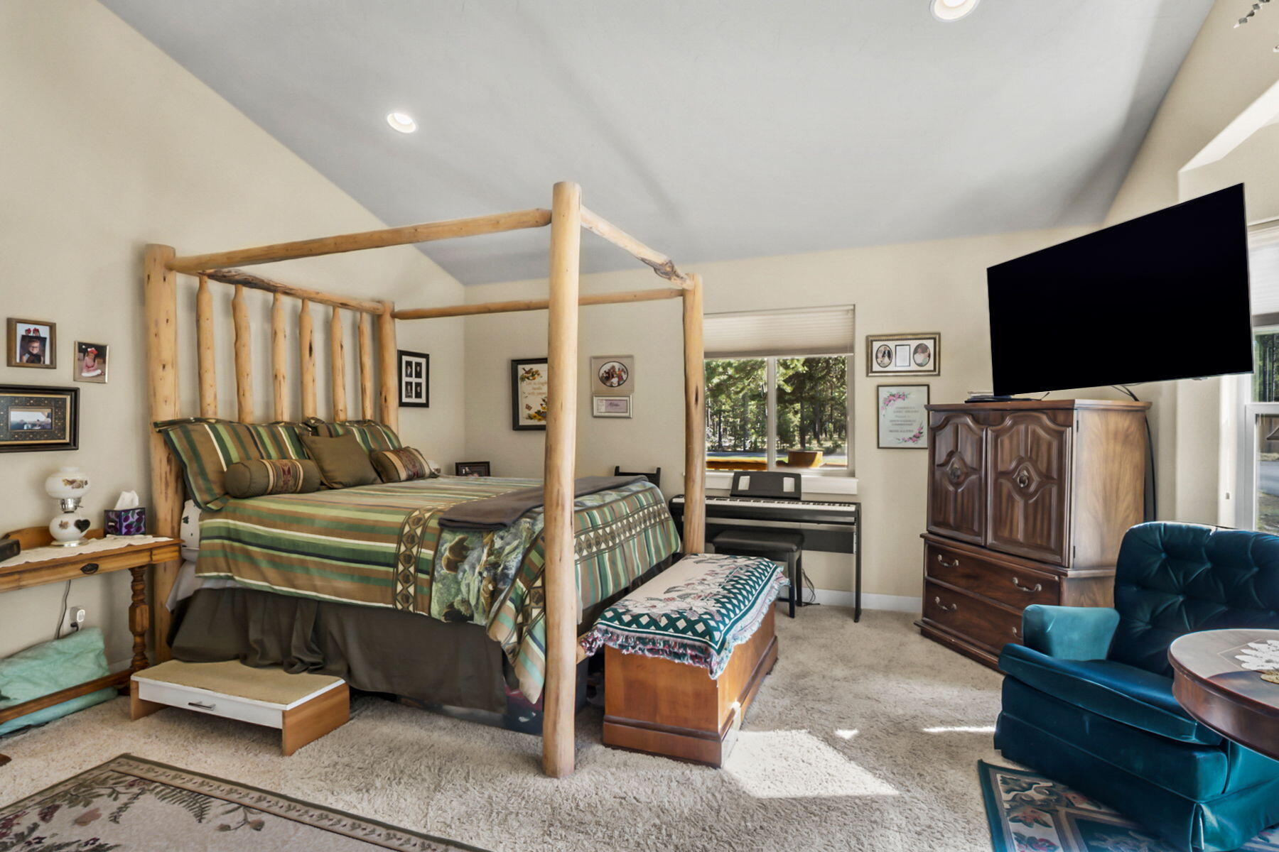 17048 Norwalk Road Bend, OR 97707 - Photo 16 of 36 a bedroom with furniture and a flat screen tv