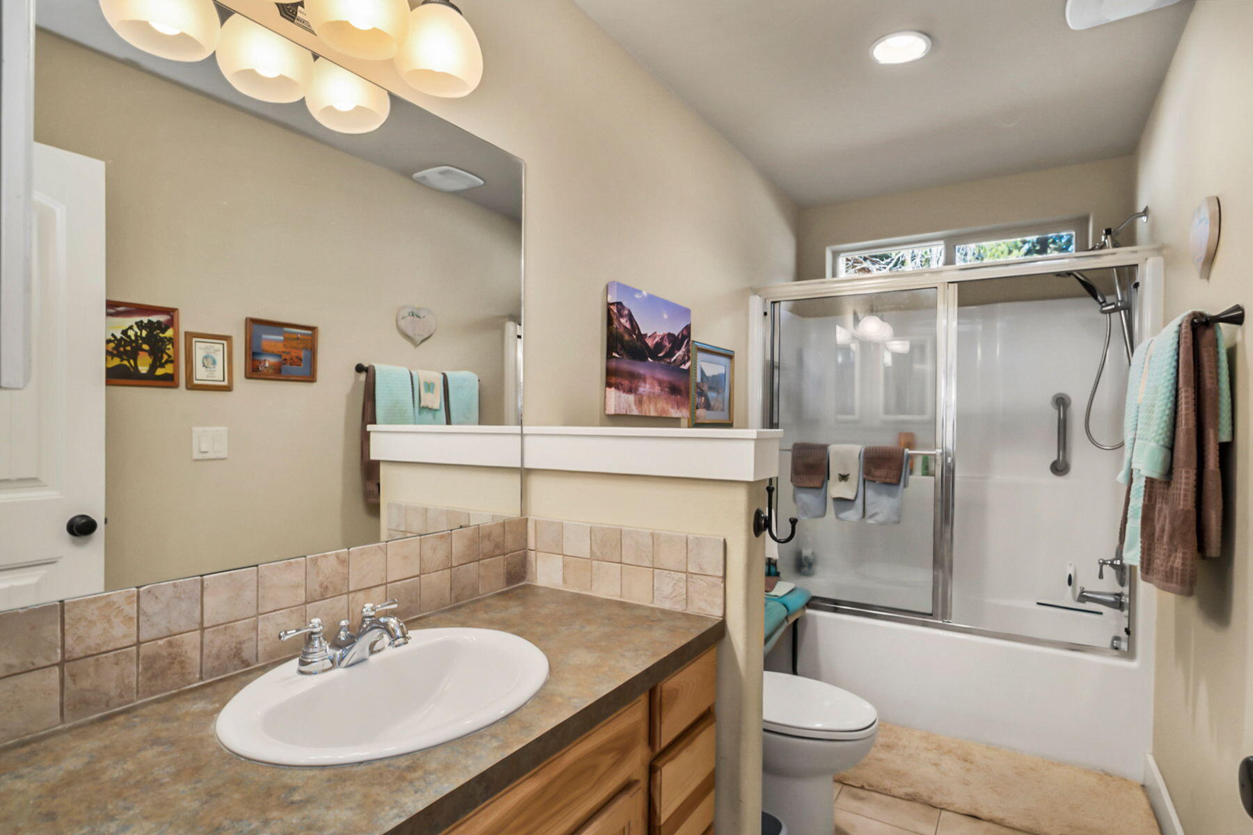 17048 Norwalk Road Bend, OR 97707 - Photo 18 of 36 a bathroom with a sink toilet and shower