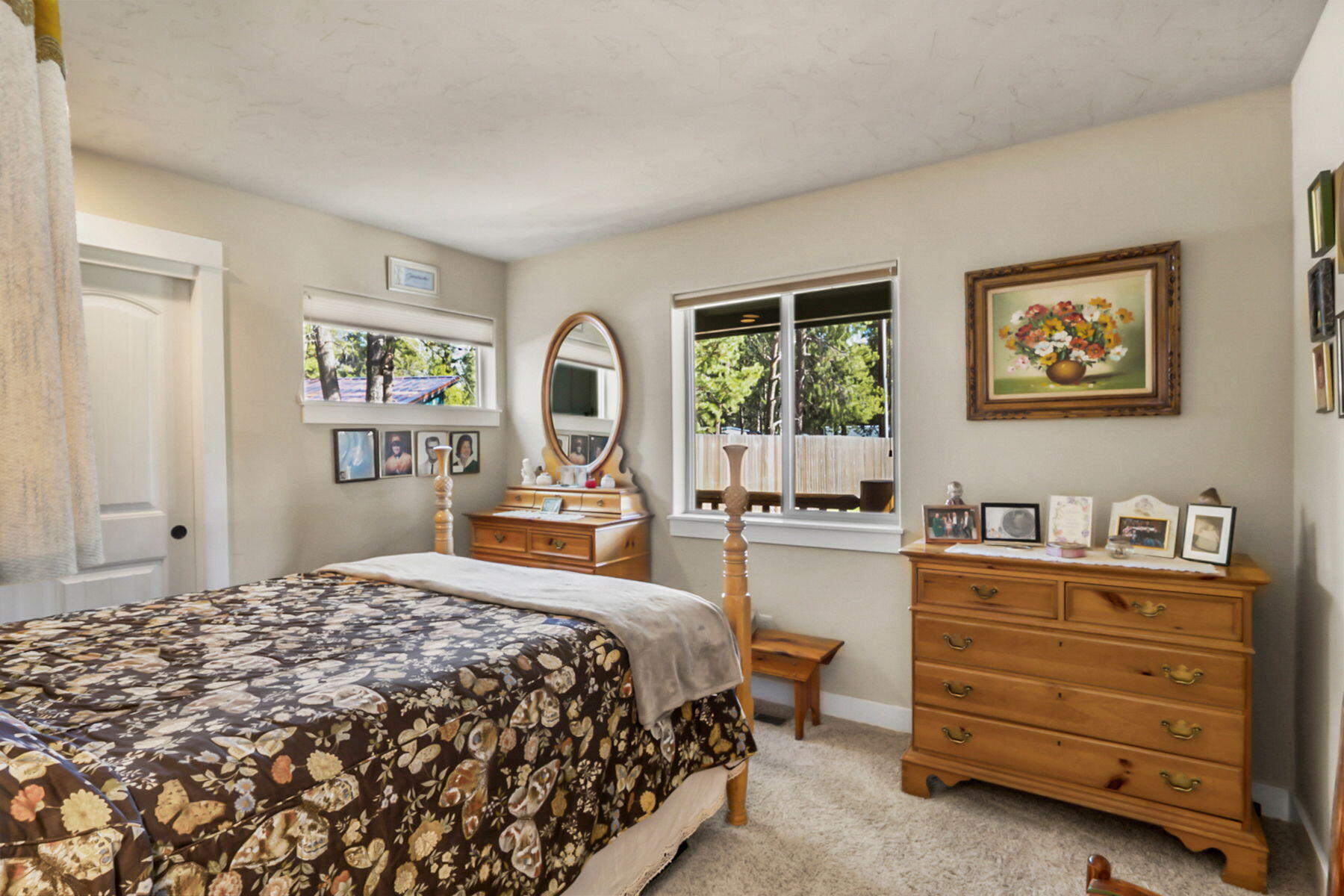 17048 Norwalk Road Bend, OR 97707 - Photo 19 of 36 a bed room with a bed and a dresser