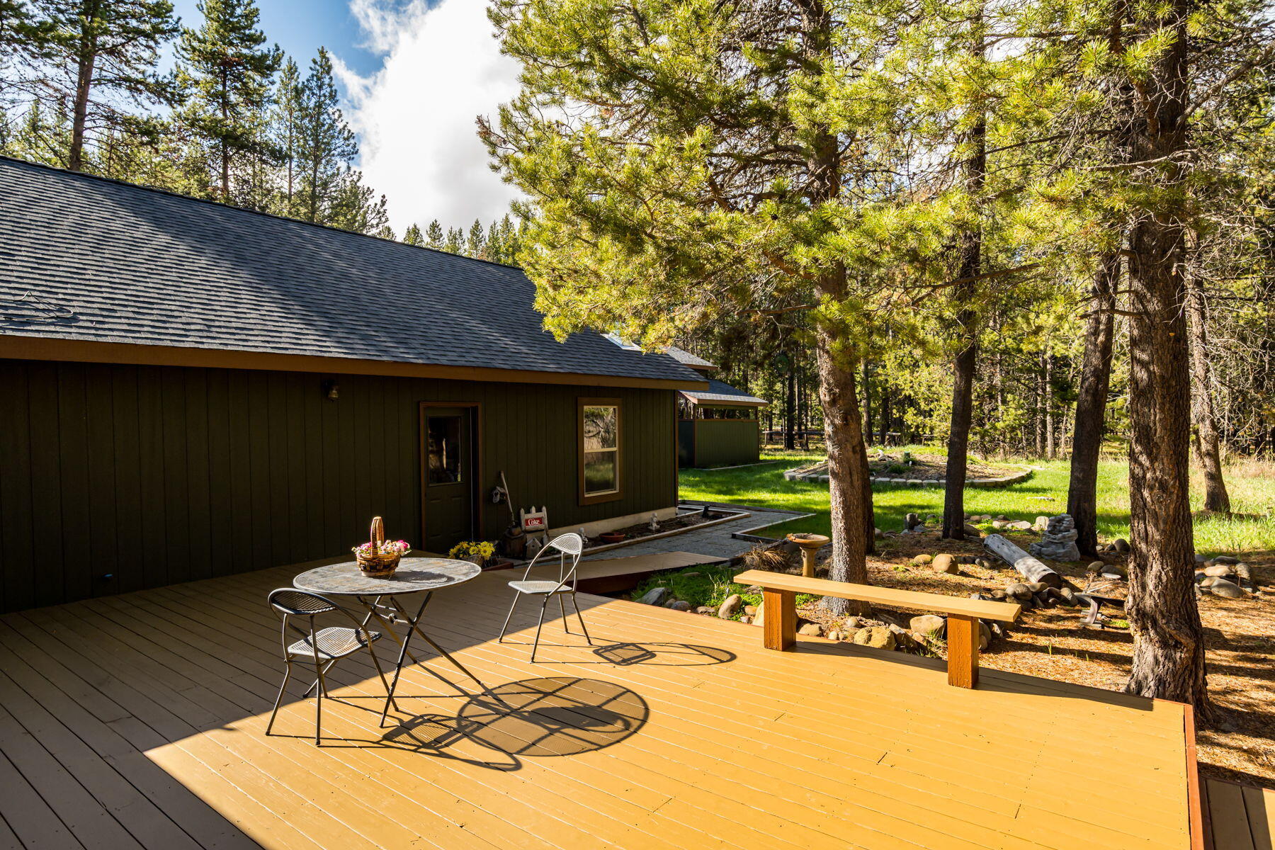 17048 Norwalk Road Bend, OR 97707 - Photo 22 of 36 a view of a chairs and tables in patio