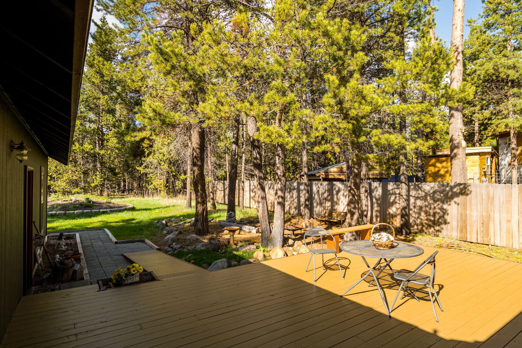 17048 Norwalk Road Bend, OR 97707 - Photo 23 of 36 a view of a swimming pool with a patio and garden