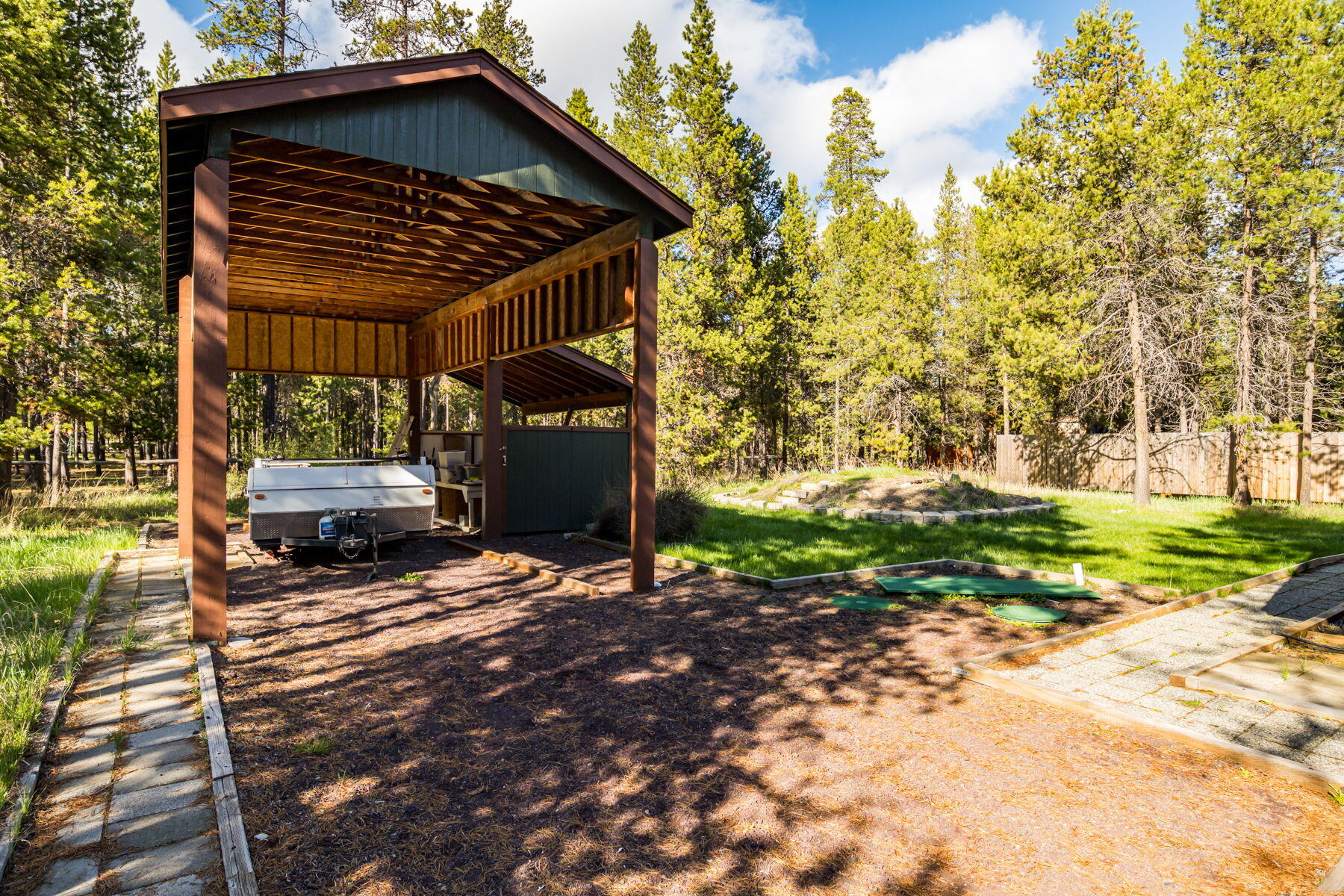 17048 Norwalk Road Bend, OR 97707 - Photo 25 of 36 a view of a house with a yard