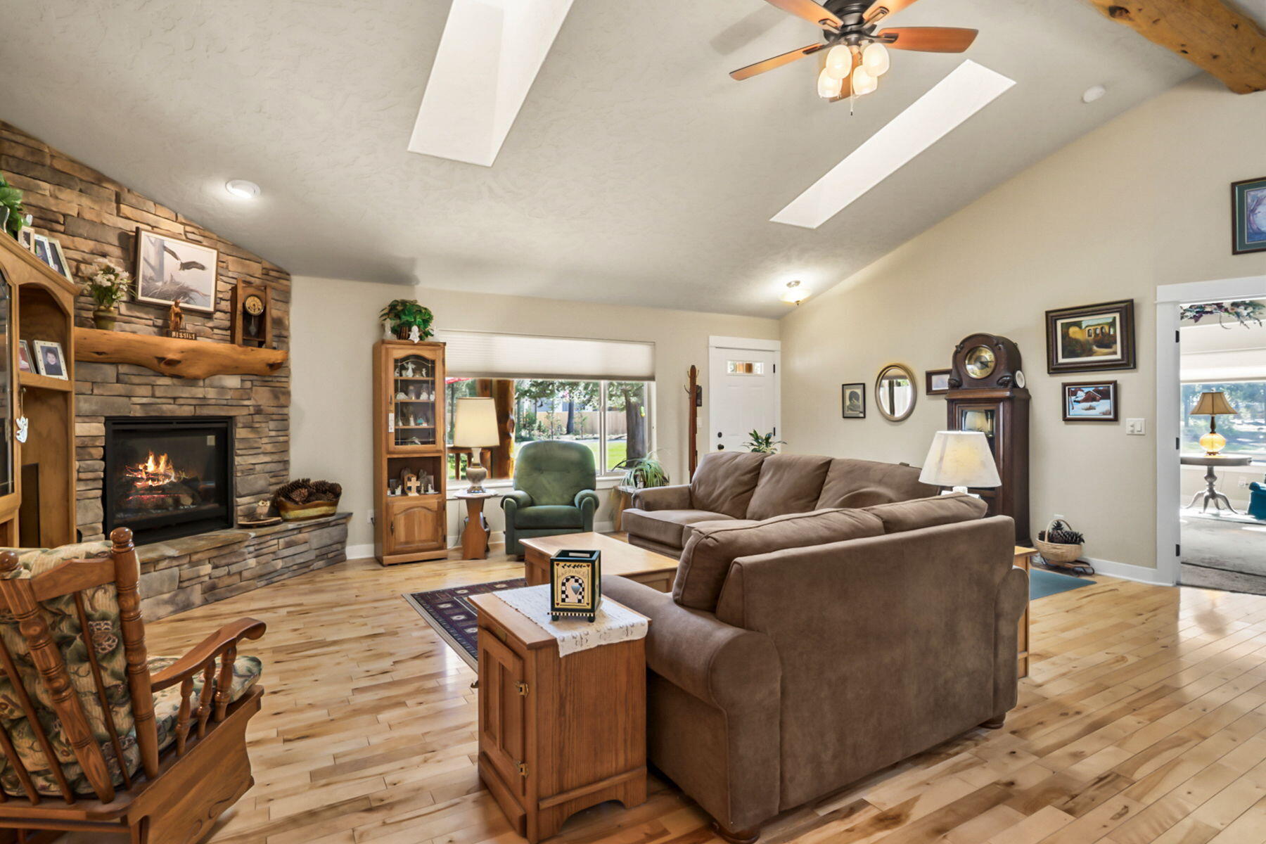 17048 Norwalk Road Bend, OR 97707 - Photo 3 of 36 a living room with furniture and a fireplace
