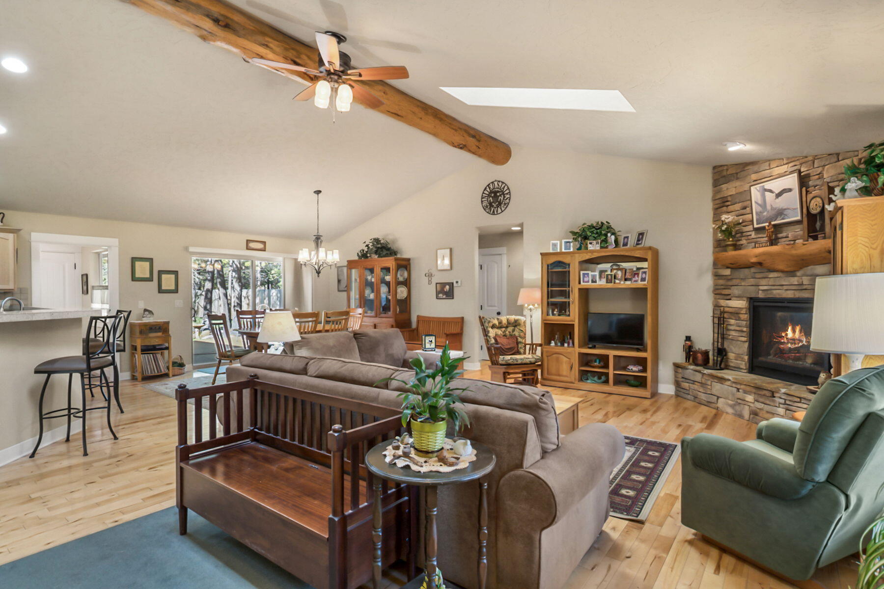 17048 Norwalk Road Bend, OR 97707 - Photo 4 of 36 a living room with furniture and a fireplace
