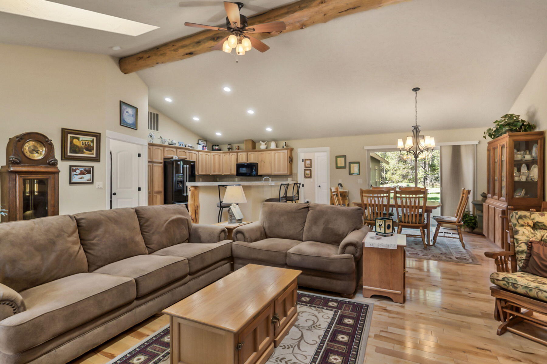 17048 Norwalk Road Bend, OR 97707 - Photo 6 of 36 a living room with furniture kitchen view and a chandelier