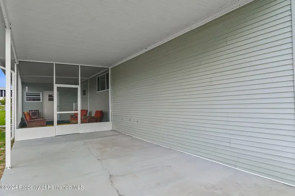 a backyard of a house with seating space