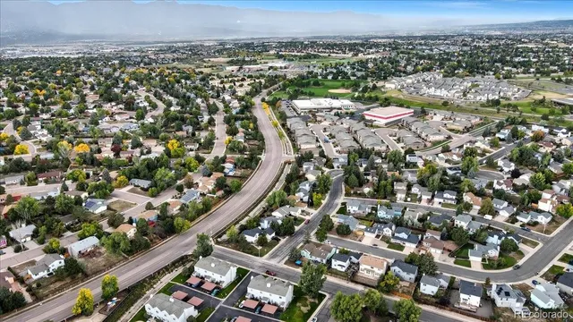 an aerial view of a house with swimming pool