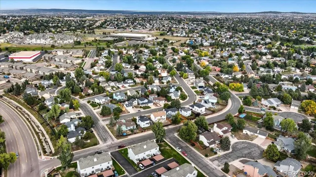 a front view of a house with a yard and porch