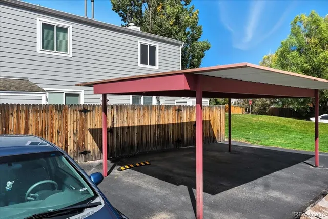 a front view of a house with garden and porch
