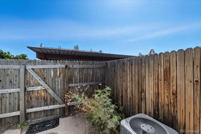 a view of a patio with a table and chairs