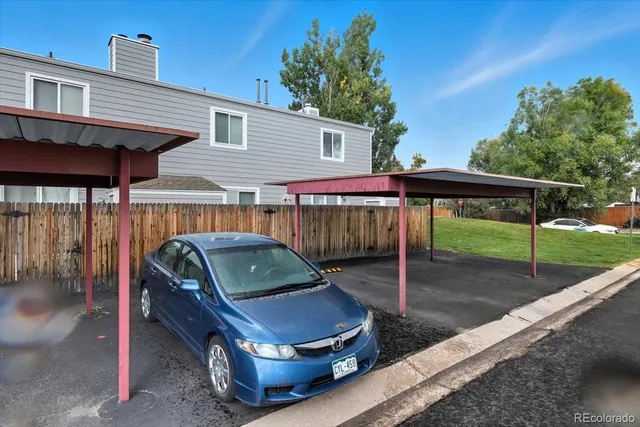 an empty room with furniture and a fireplace