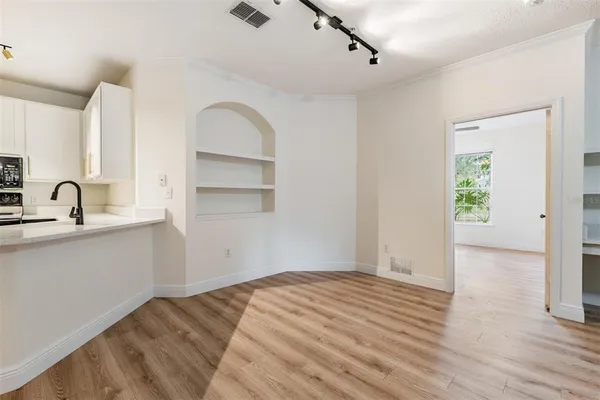 a view of a kitchen with wooden floor
