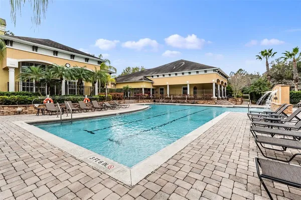 a view of a swimming pool with a garden