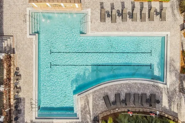 a view of a swimming pool with outdoor seating