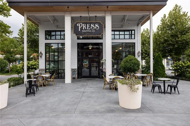 a view of a house with car parked