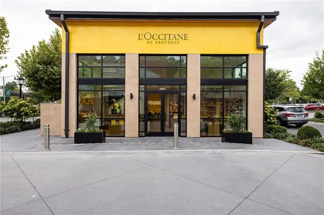 a view of a patio with table and chairs and potted plants