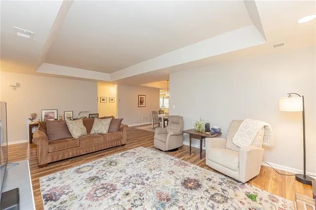 a living room with furniture and a rug